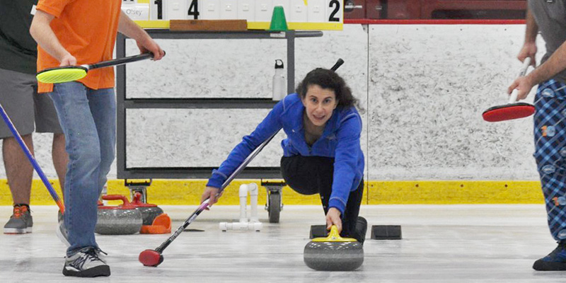 Curling players celebrating after a game